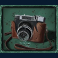 kiss-my-chainsaw-slot-chainsaw-larry-spin-camera-symbol